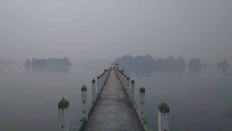 A concrete pier on a misty morning on Van Don Peninsular in Quang Ninh