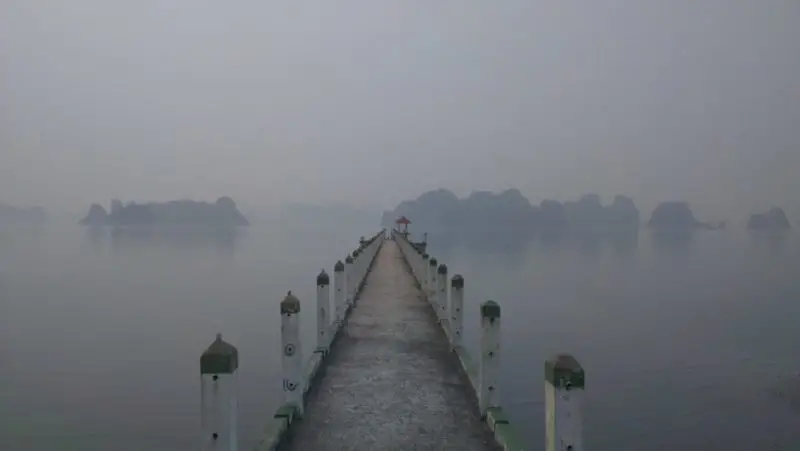 A concrete pier on a misty morning on Van Don Peninsular in Quang Ninh