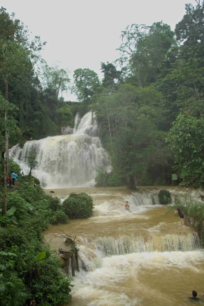 A brown coloured waterfall after rain during the wet season