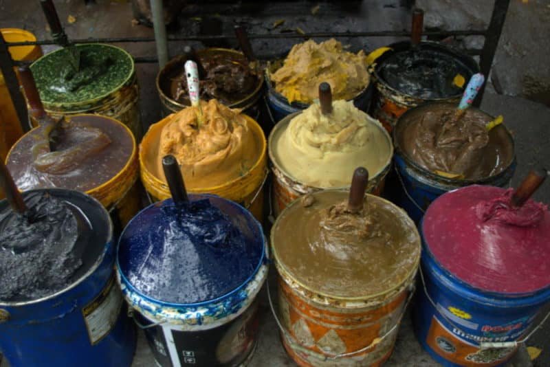 Buckets of colored grease that looks like ice cream