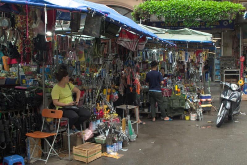 outdoor market stalls selling hand tools