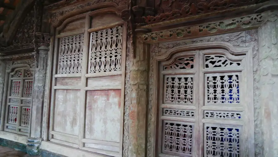 Hand-carved wooden church doors that are over a century old