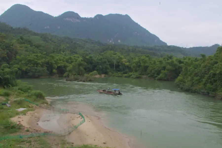 Boat on the river at the gate of Ha Giang city during a motorbike tour
