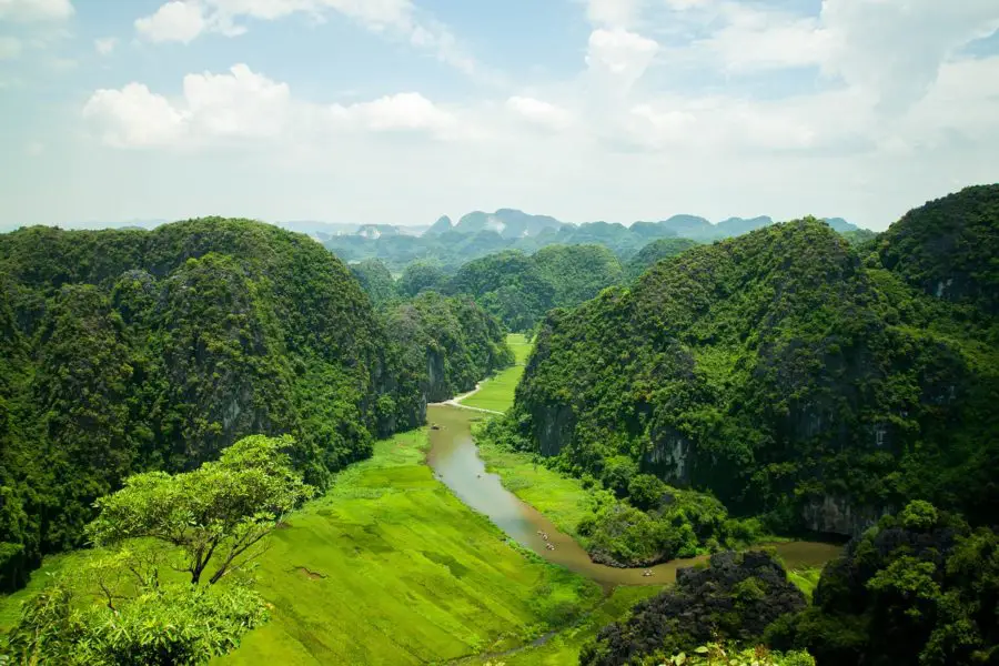 Boats on the river at Tam Coc in Ninh Binh a motorbike tour destination in Vietnam