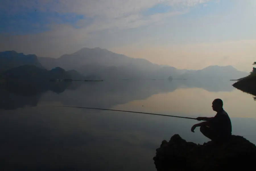 Fishing in Da Bac, Hoa Binh, Vietnam at sunrise