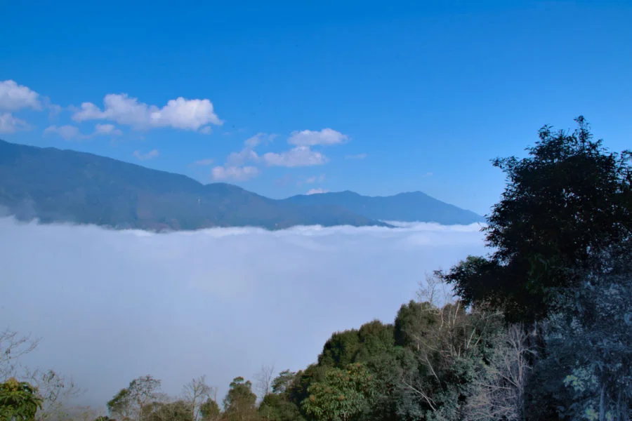 Above the clouds of Ta Xua in the mountains of Vietnam on a motorbike tour