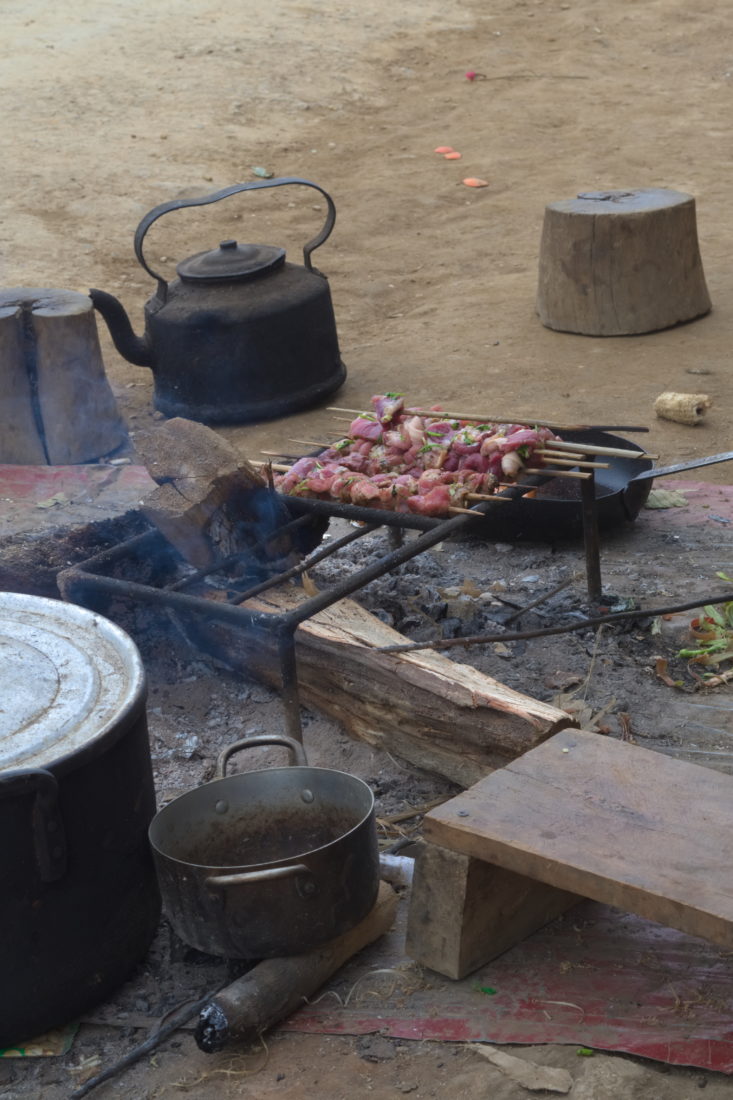 Kebabs roasted over a fire at Dragonback Ridge, Ta Xua, Vietnam