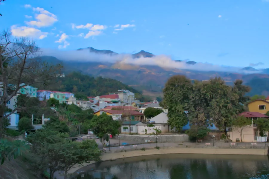 Looking up to Ta Xua mountains from Bac Yen City on a motorbike tour of vietnam