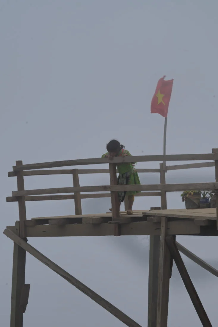 Minority girl in the cloudsof Ta Xua, Vietnam