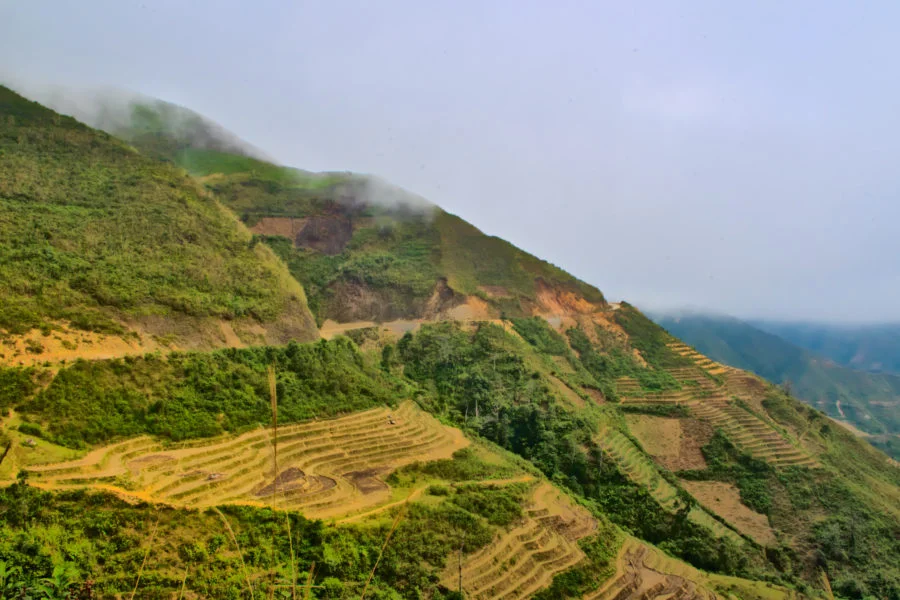 Mountain road with rice terraces at Ta Xua on a motorbike tour of Vietnam