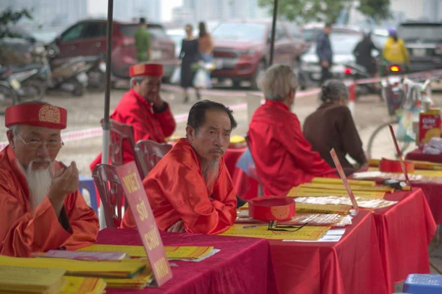 vietnamese fortune teller men dressed in red