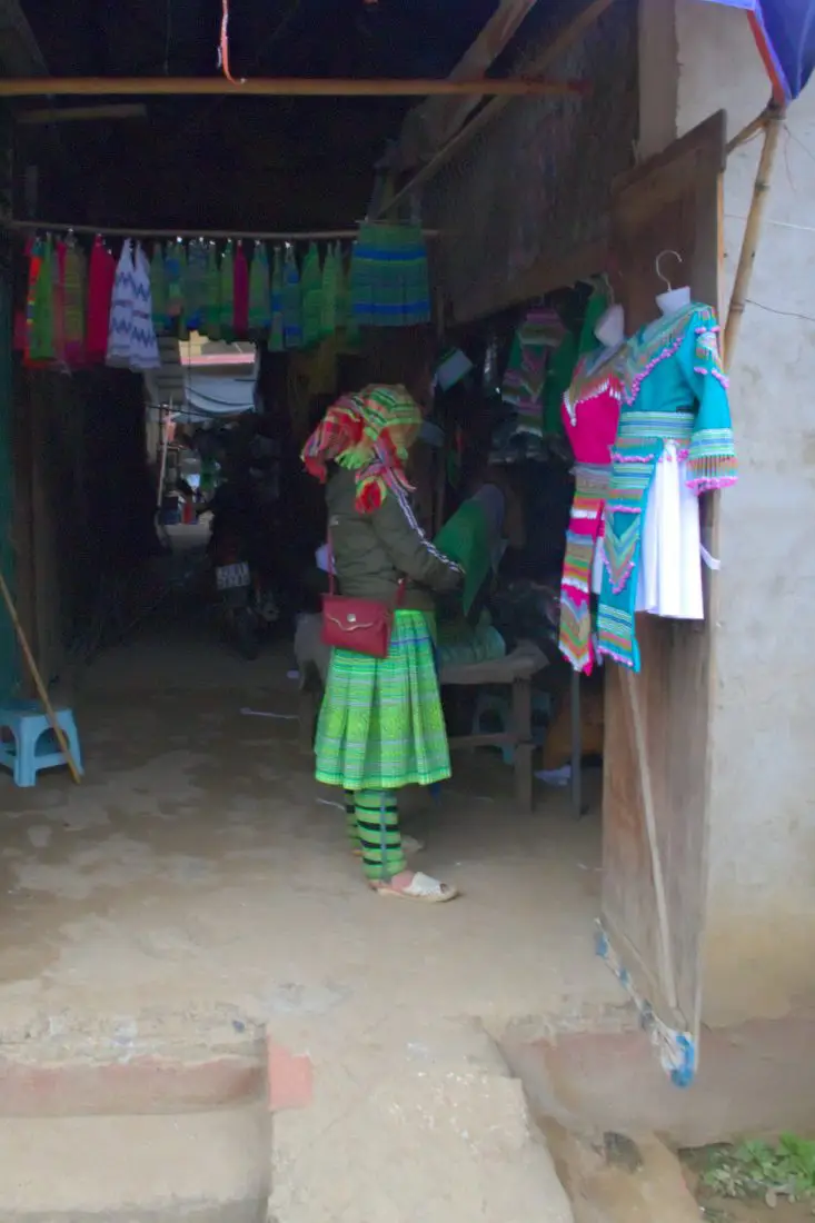 A Mong lady clothes shopping at a traditional market in Vietnam