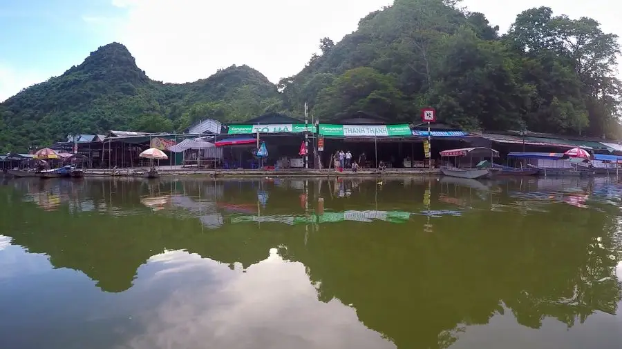 boat docks and a river reflection at a Vietnamese temple in Hanoi