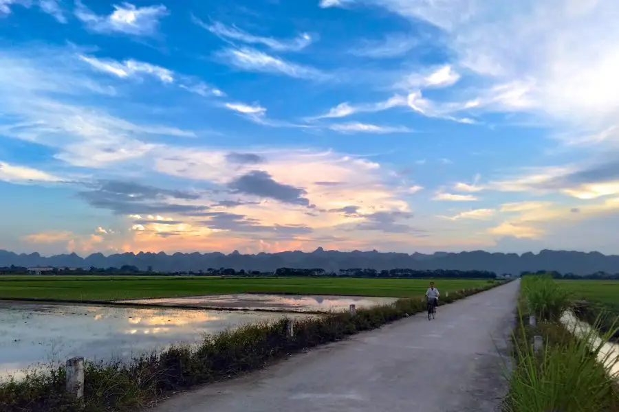 A sunset on the city limits of Hanoi next to Chua Huong