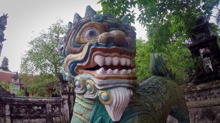 Nice old style lion statue A clourful lion statue at a Vietnamese pagoda