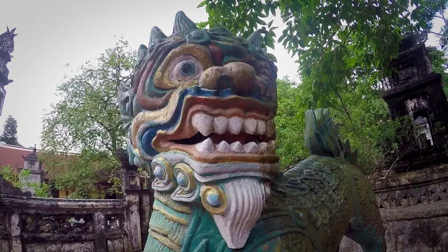 A clourful lion statue at a Vietnamese pagoda