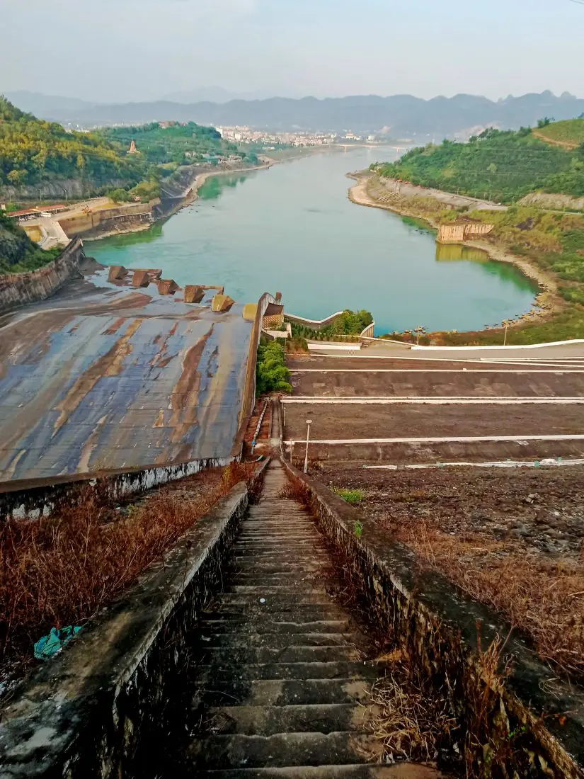 A spillway and blue river at a Vietnamese dam