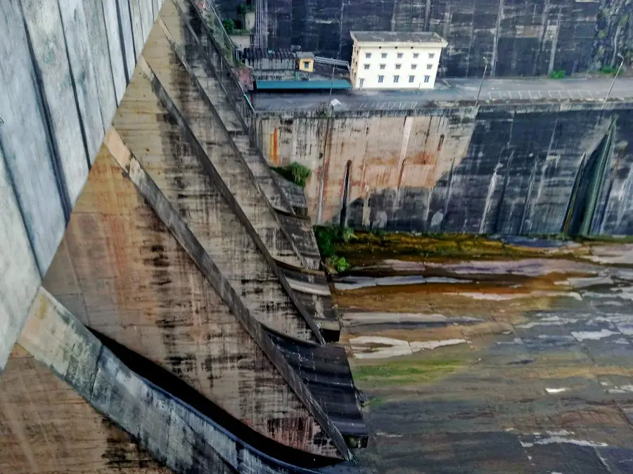 looking down at the release flow gates of a hydropower dam